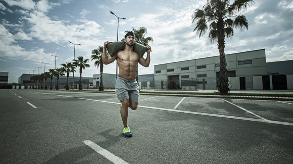 Build Upper Body Strength with These Sandbag Exercises